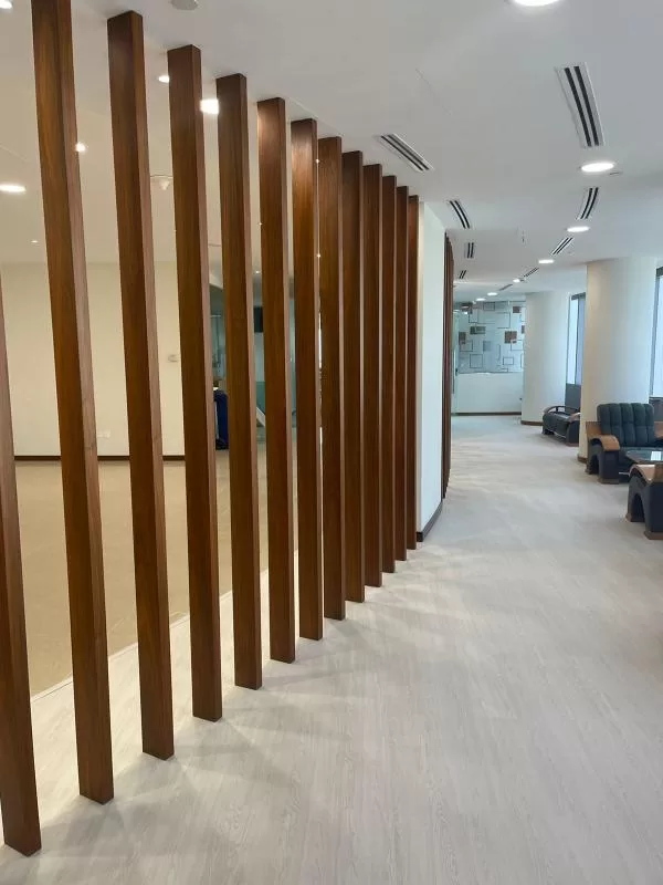 Modern Office Interior Services with Sofa Upholstery and Wood Partition Designs